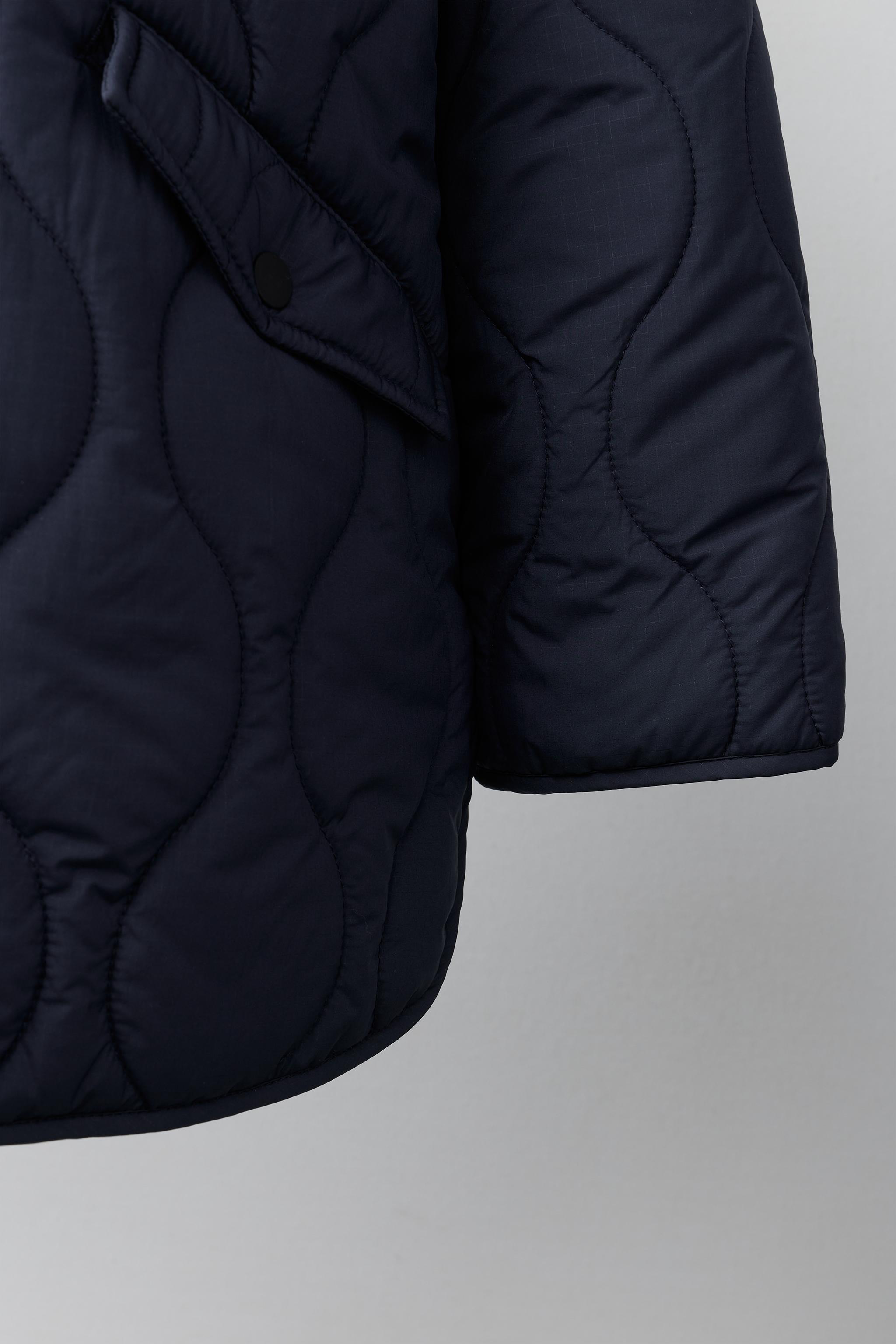 BLOUSON MATELASSÉ À CAPUCHE DÉPERLANT